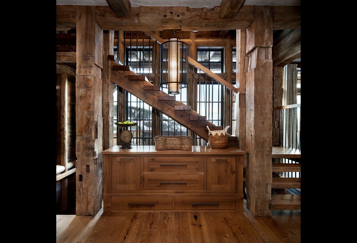 A wooden staircase leading up to the second floor of a house