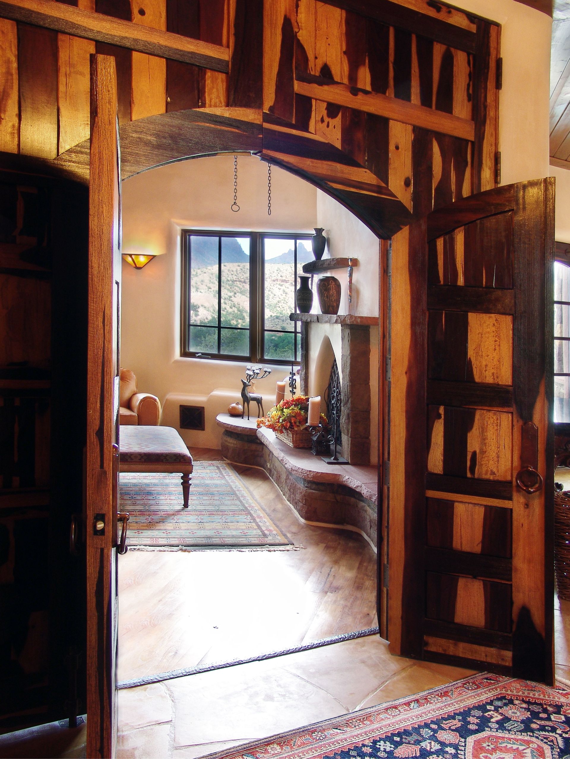 A living room with a fireplace and a rug