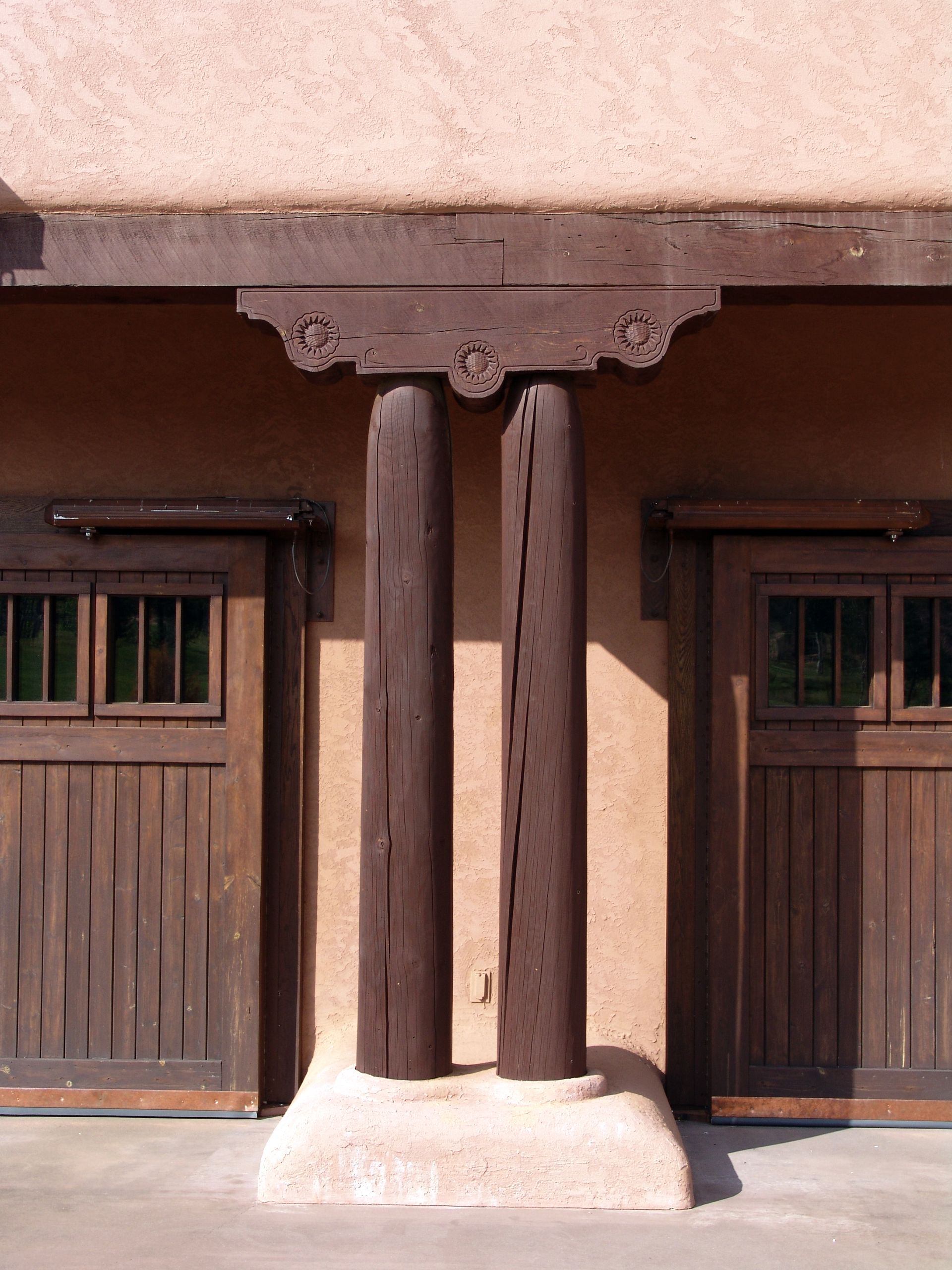 A row of wooden garage doors on a building