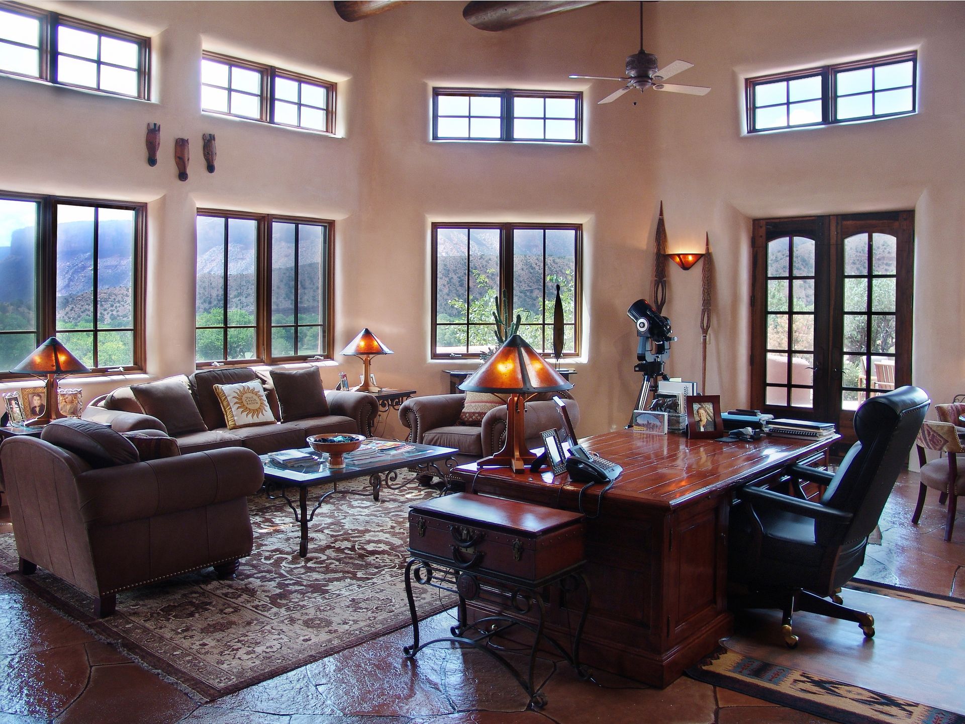 A living room filled with furniture and a desk