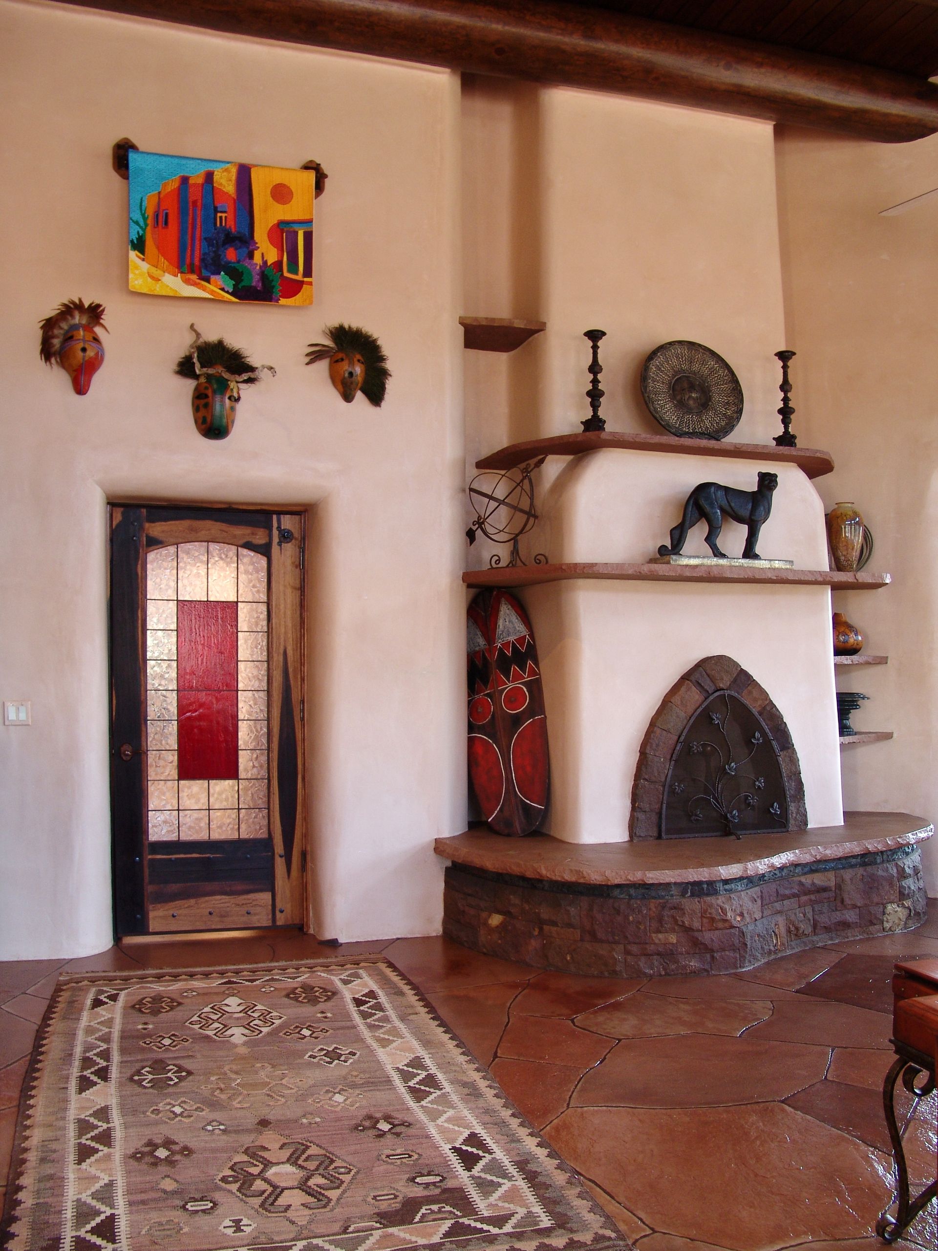 A living room with a fireplace and a rug