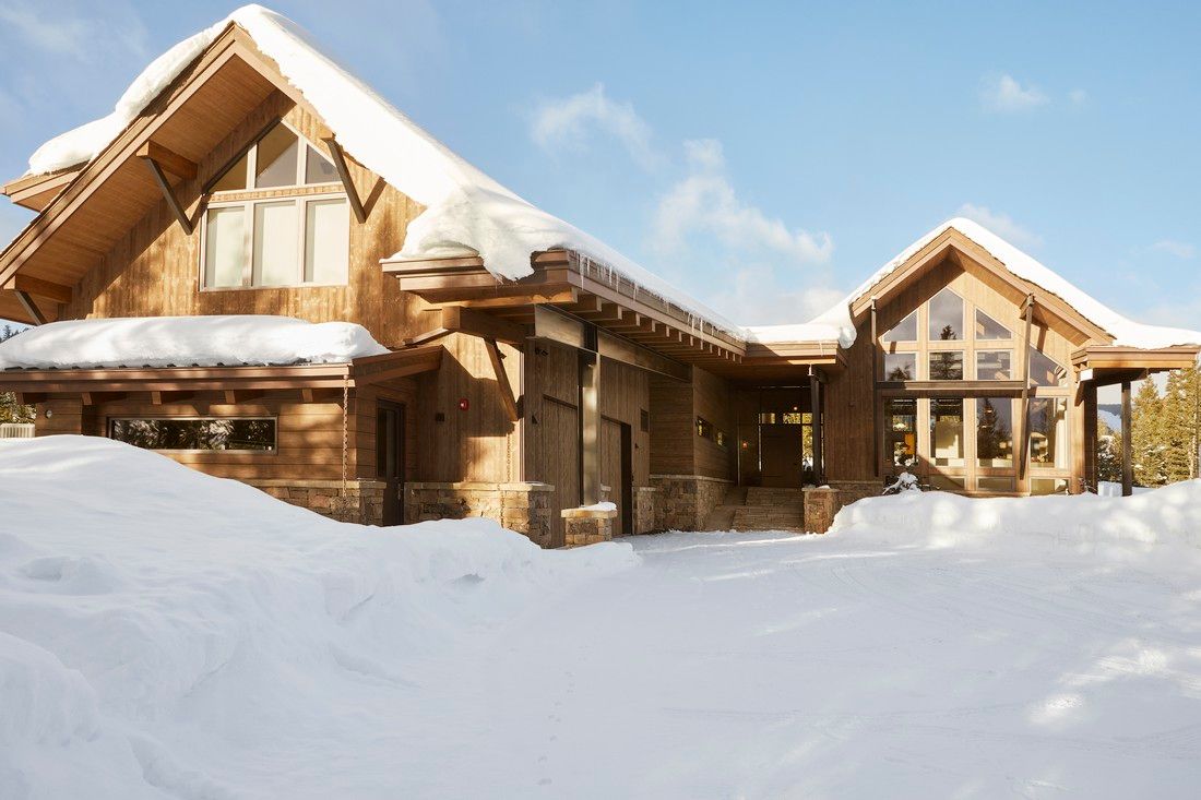 A large house with a lot of snow on it