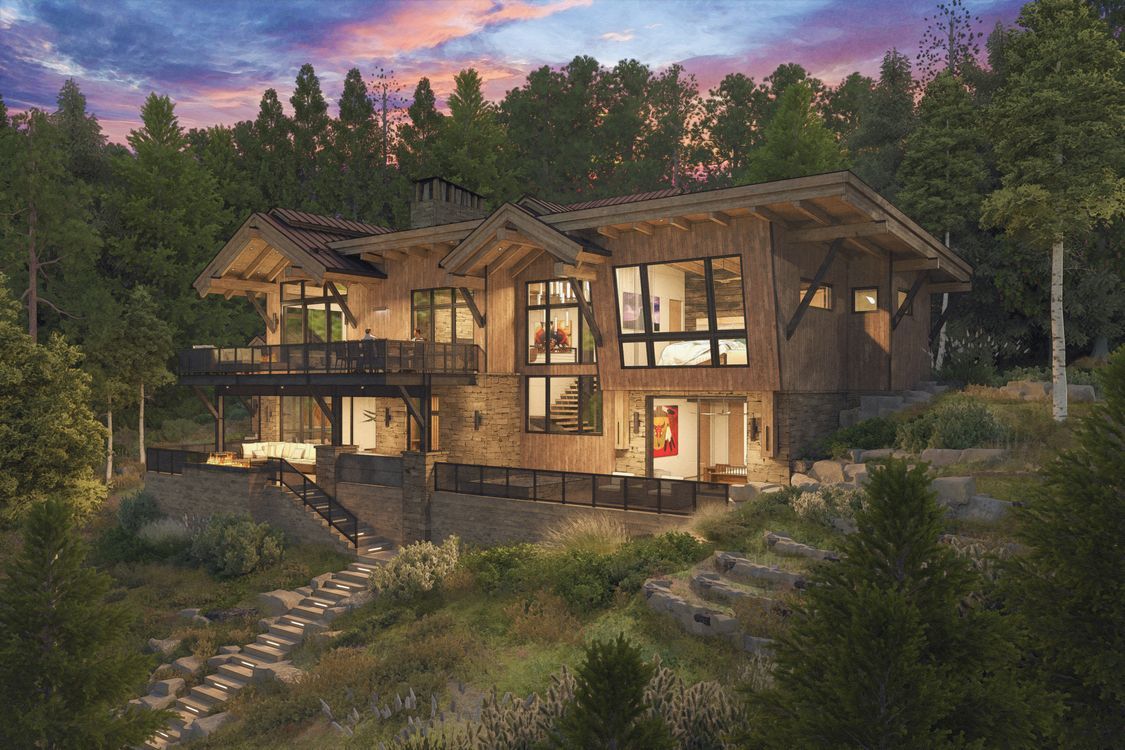 A large house is sitting on top of a hill in the middle of a forest.