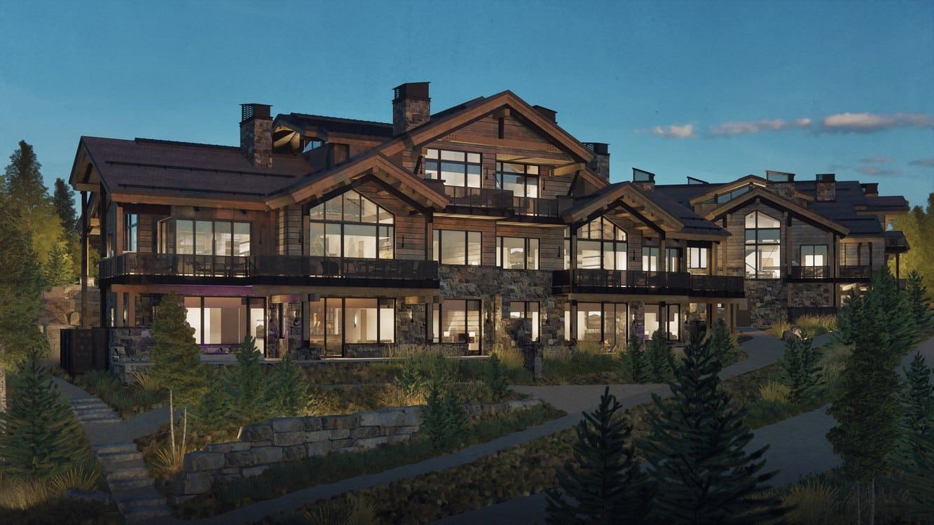 A large house is sitting on top of a hill surrounded by trees.