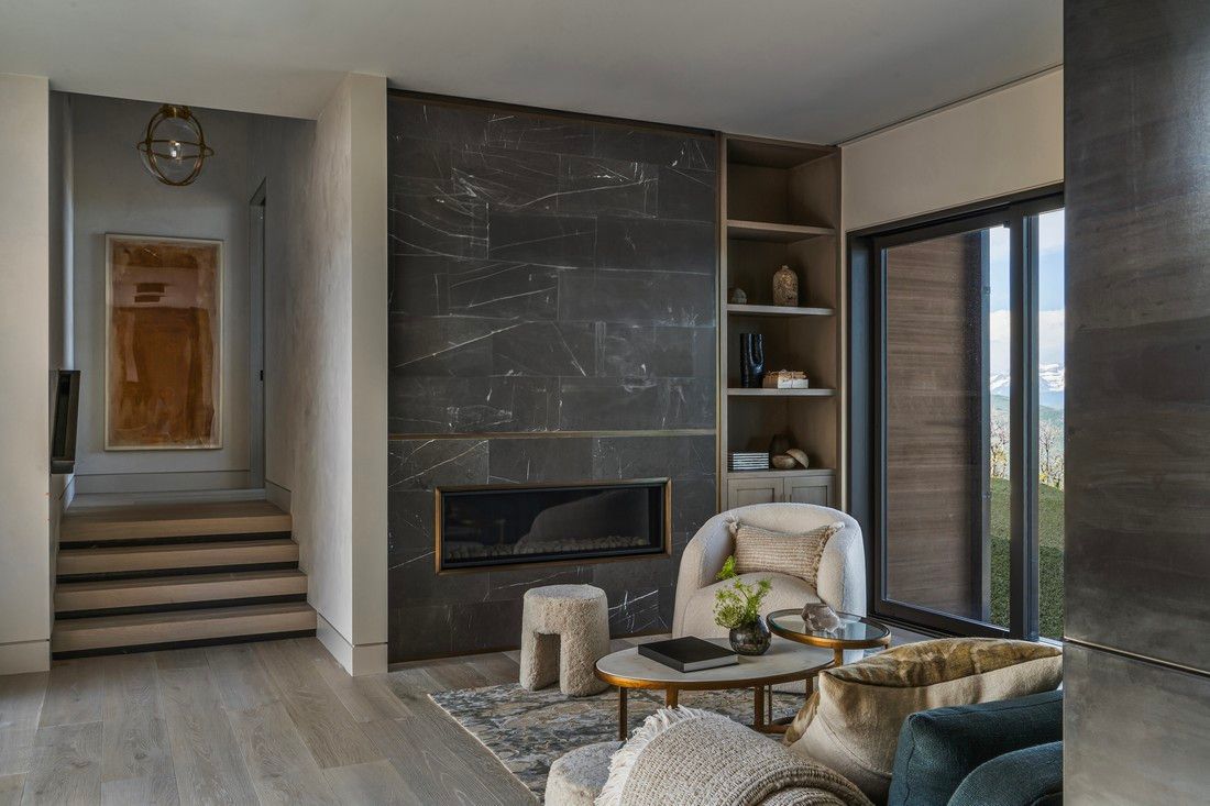 A living room filled with furniture and a fireplace.