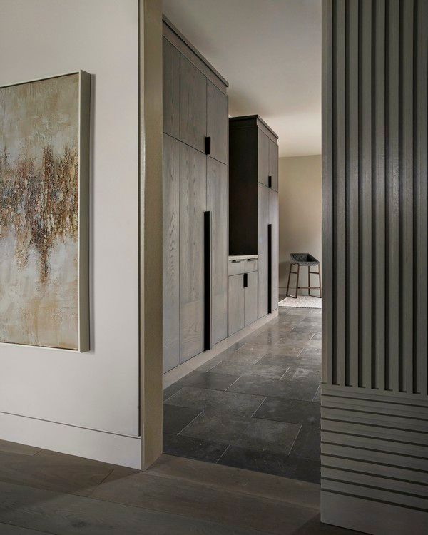 A hallway with a painting on the wall and a painting on the wall.