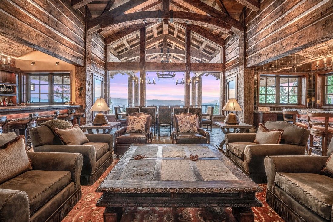 A living room filled with furniture and a large table.