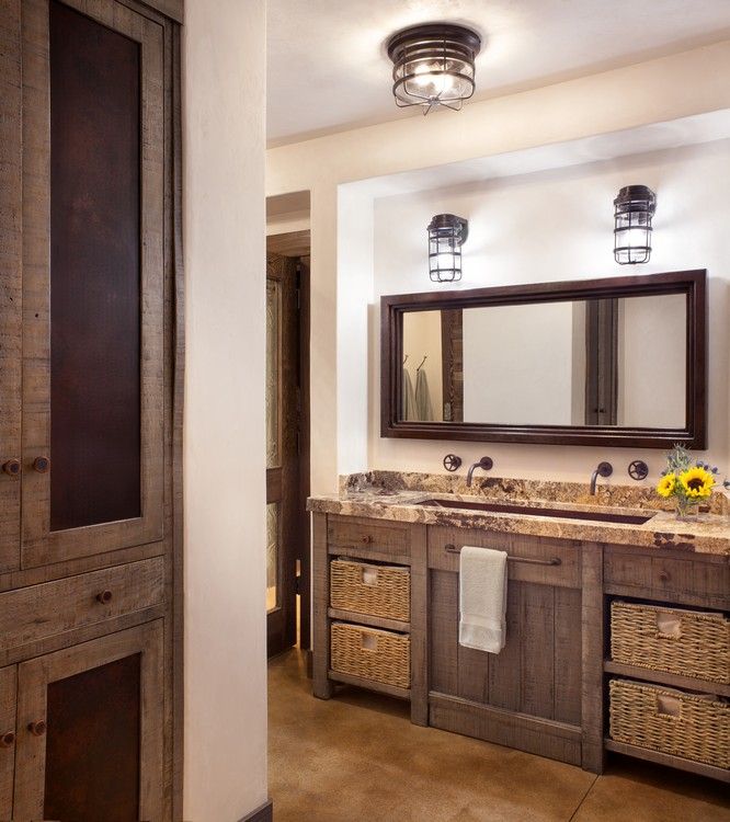 A bathroom with two sinks and a large mirror