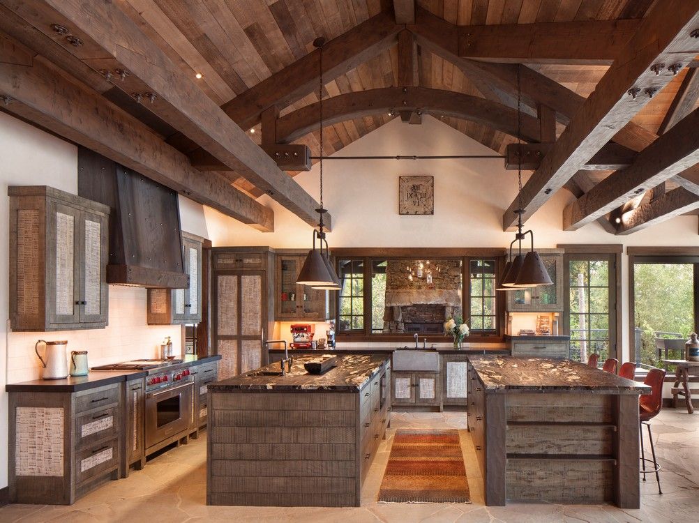 A kitchen with a lot of wooden beams and cabinets
