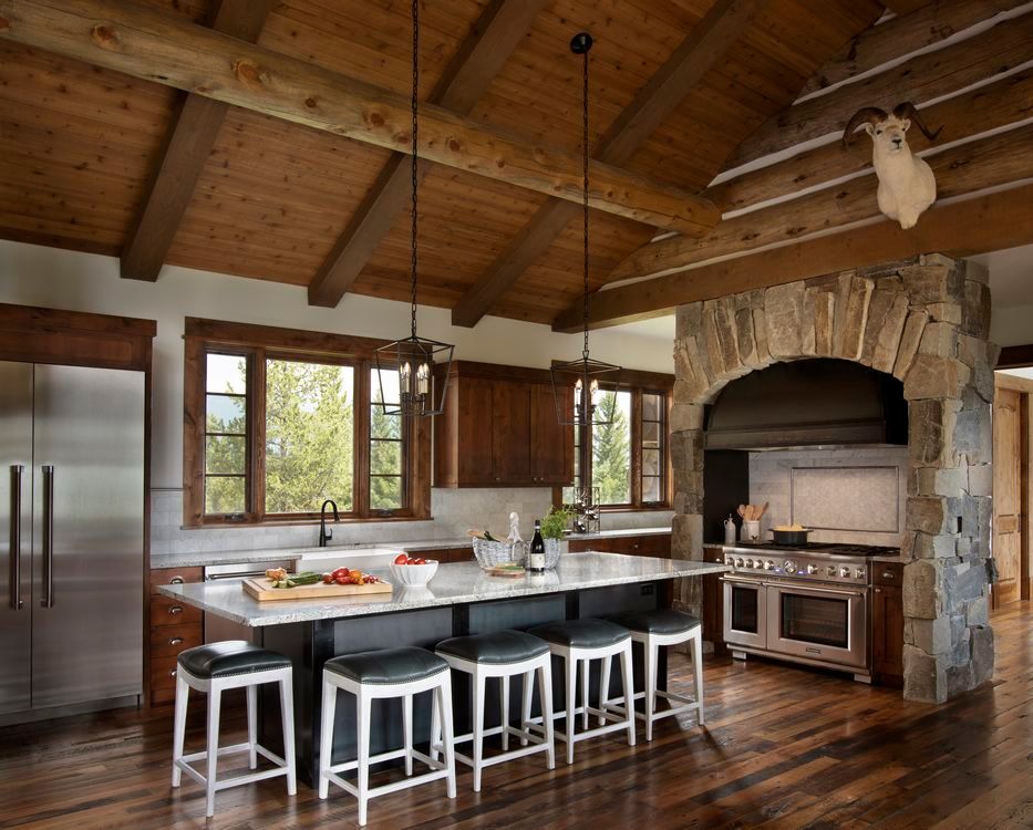 A kitchen with a large island and stools