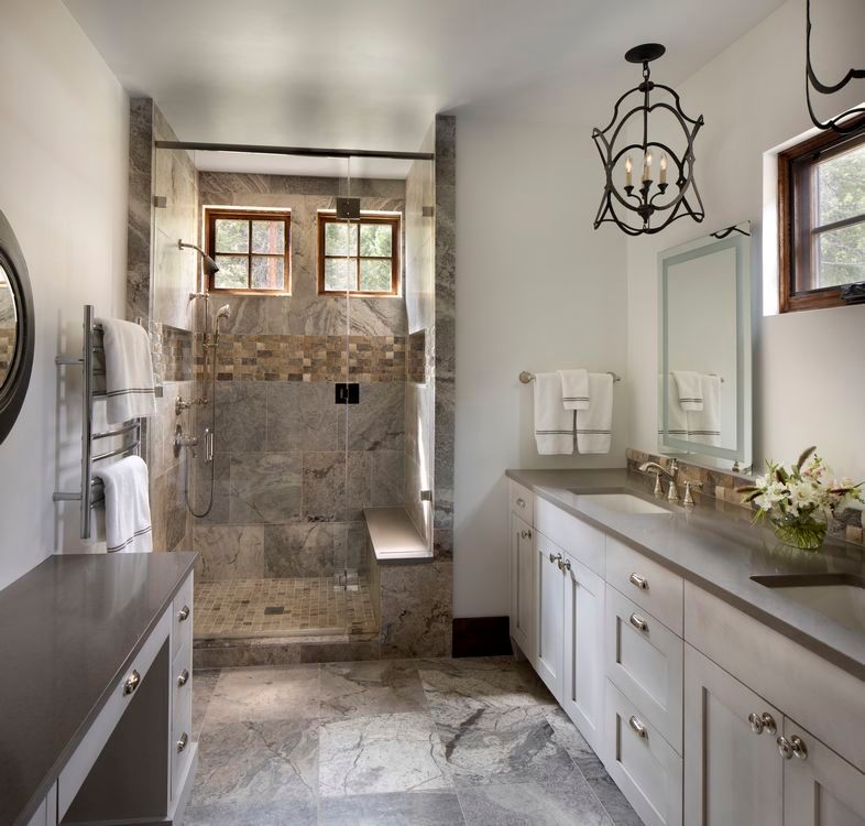 A bathroom with a sink and a walk in shower