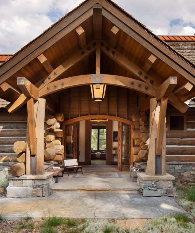 A log cabin with a lantern hanging from the roof