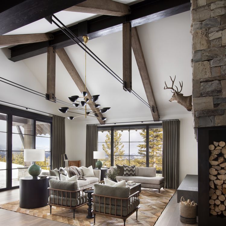 A living room with a deer head on the wall