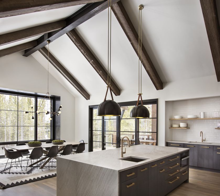A kitchen with a large island and a sink