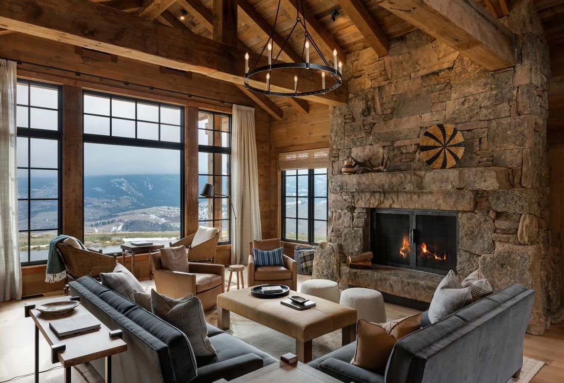 A living room filled with furniture and a fireplace.