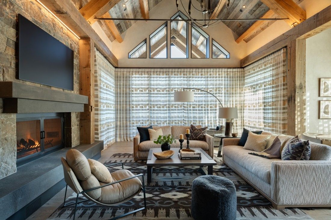 A living room filled with furniture and a fireplace.