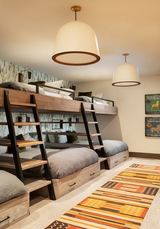 A bedroom with bunk beds and a rug.