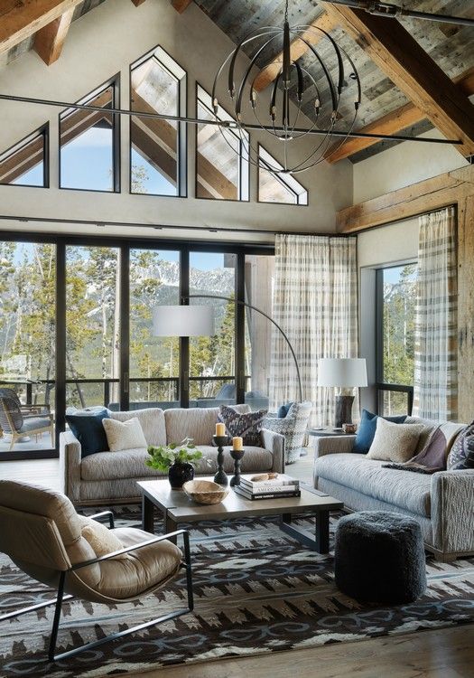A living room filled with furniture and a chandelier.