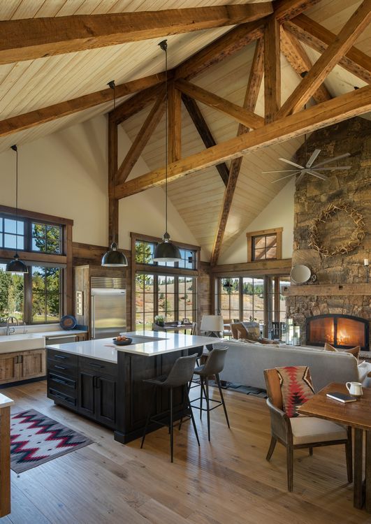 A kitchen with a large island and a fireplace