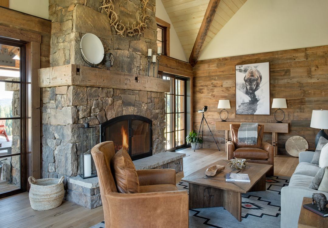 There is a fireplace in the middle of the living room.