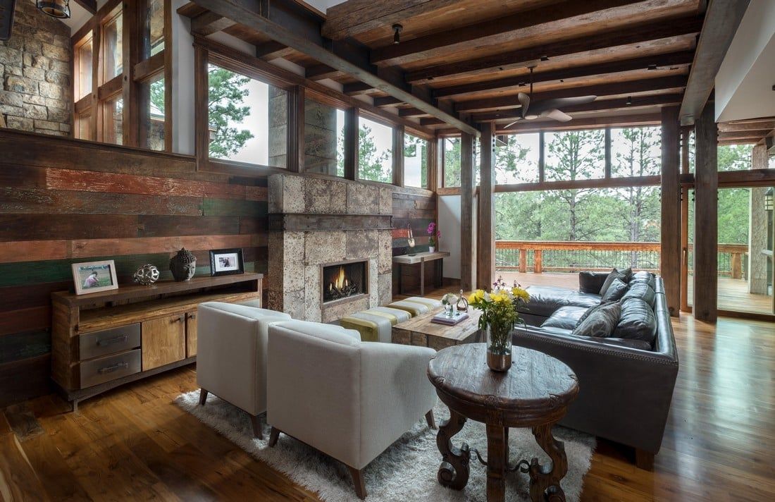 A living room filled with furniture and a fireplace.