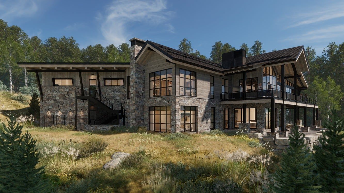 A large house is sitting on top of a hill in the middle of a forest.