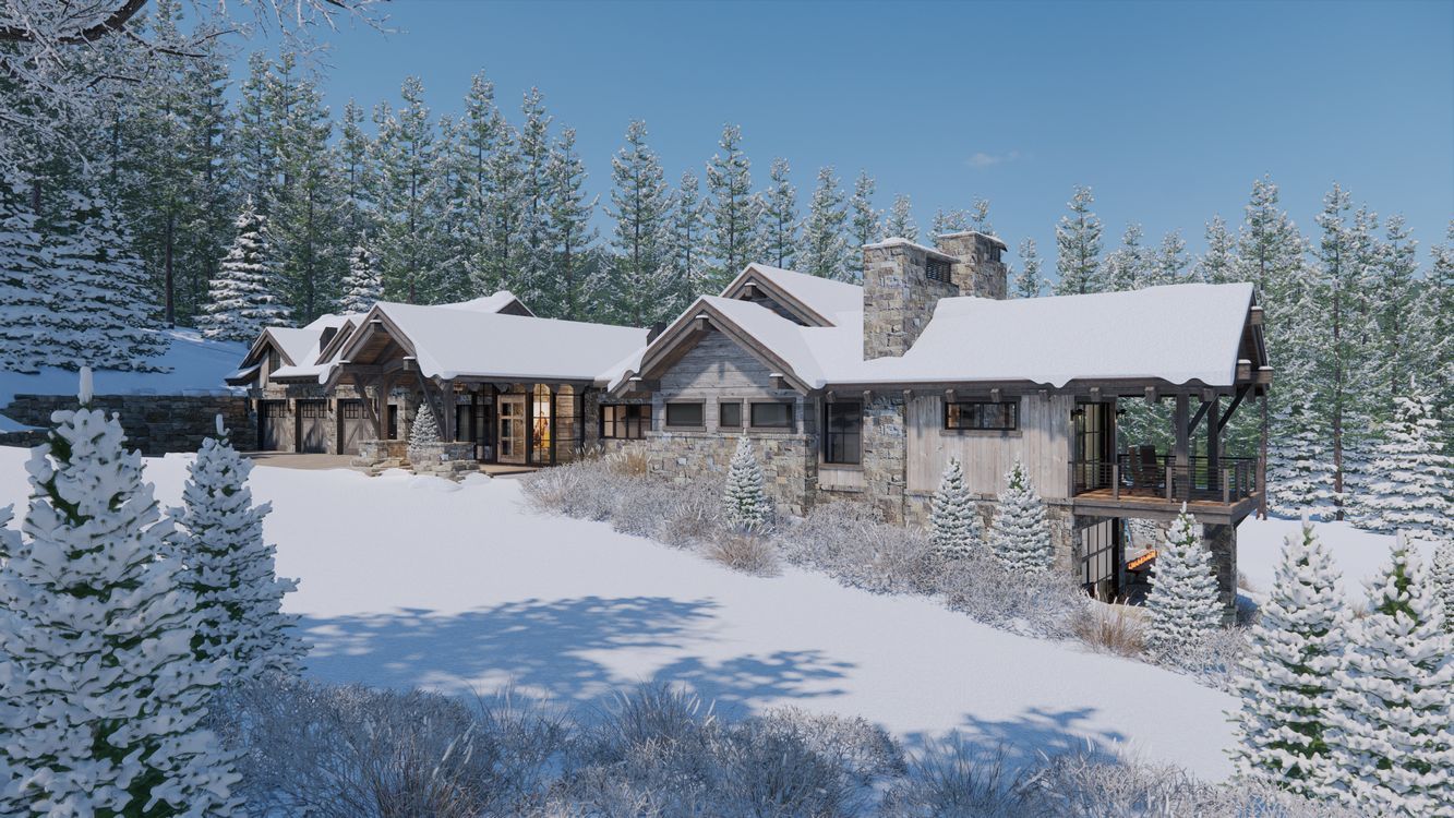 A large house is surrounded by snow covered trees in the middle of a snowy forest.