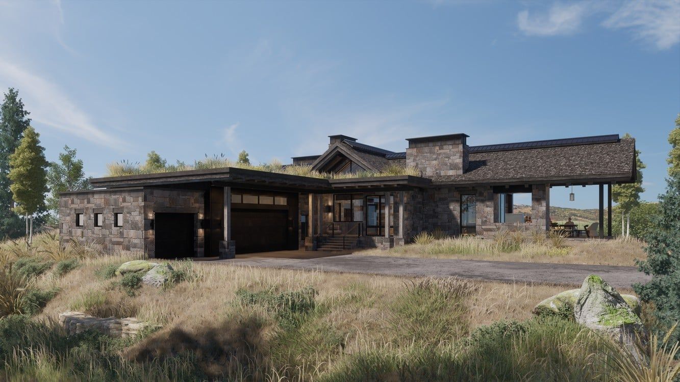 A large house is sitting on top of a hill in the middle of a field.