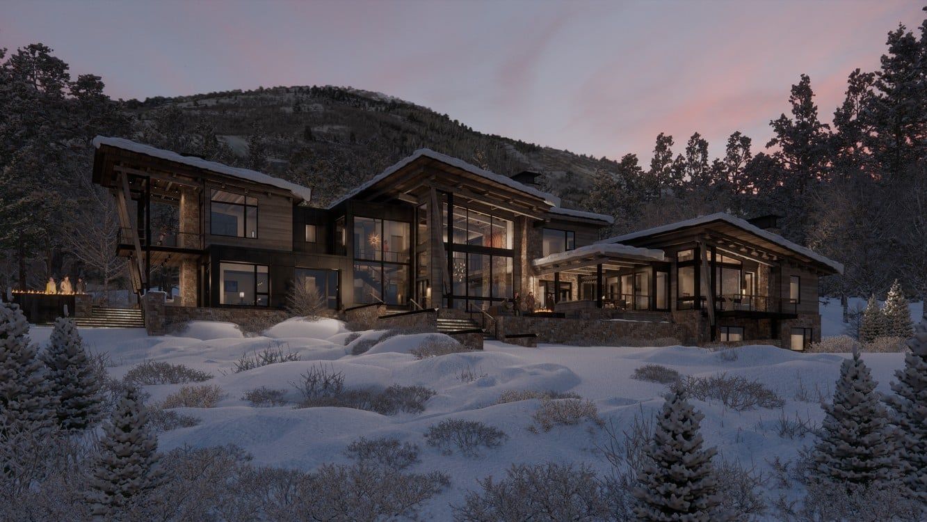 A large house is sitting in the middle of a snow covered field.