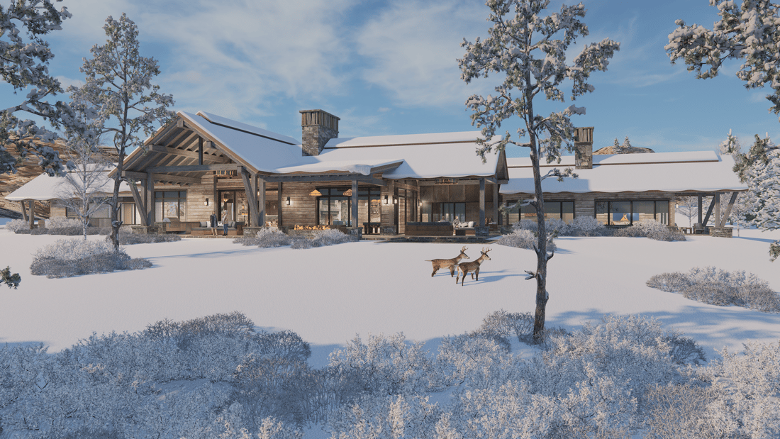 A large house is surrounded by snow and trees.