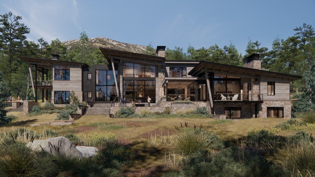 A large house is sitting on top of a hill surrounded by trees.