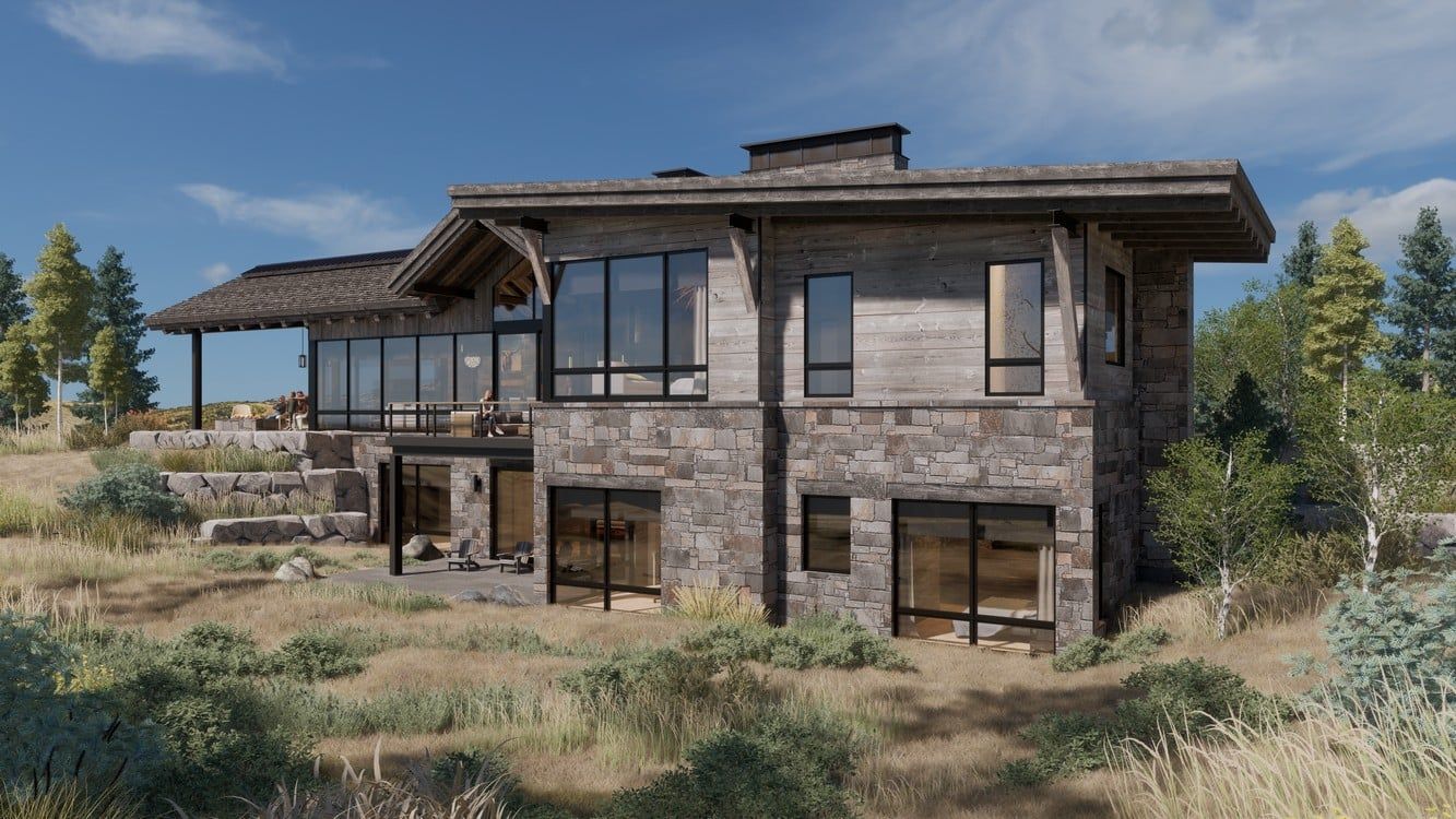 A large stone house is sitting on top of a hill in the middle of a field.