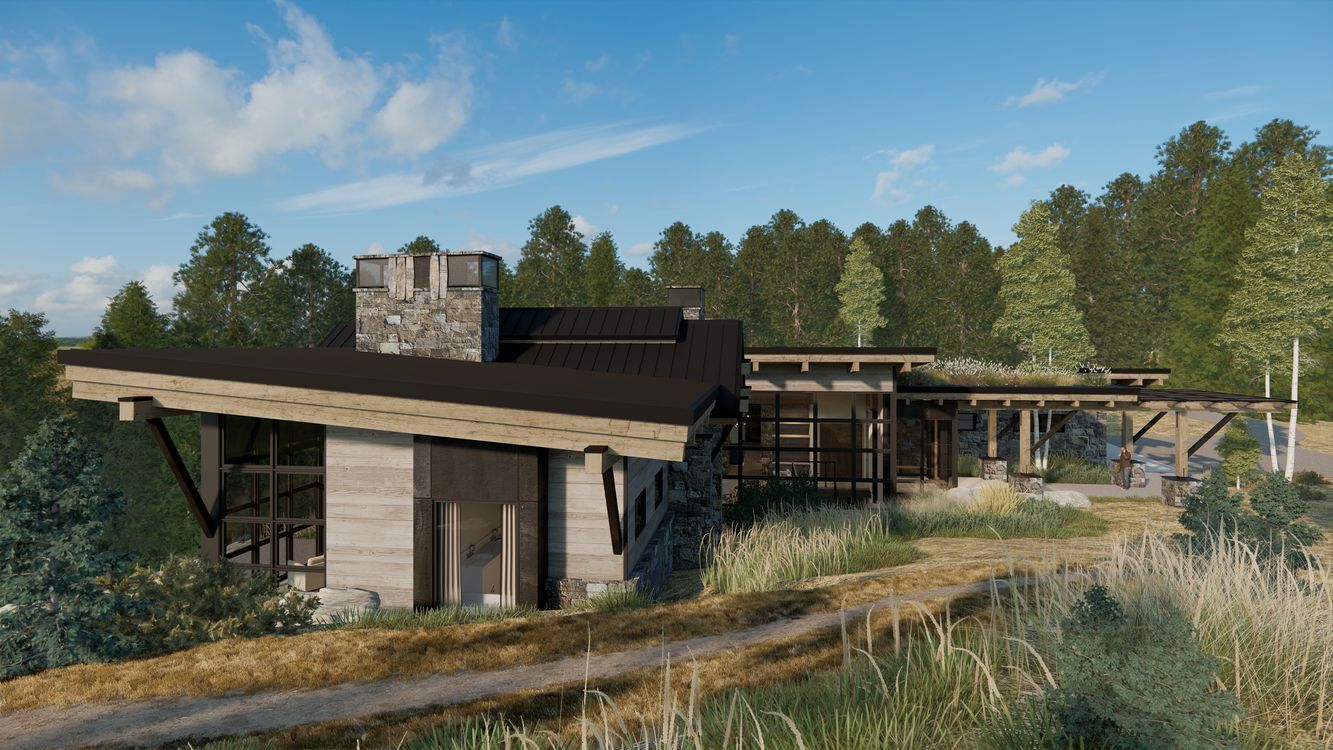 A house is sitting on top of a hill in the middle of a field surrounded by trees.