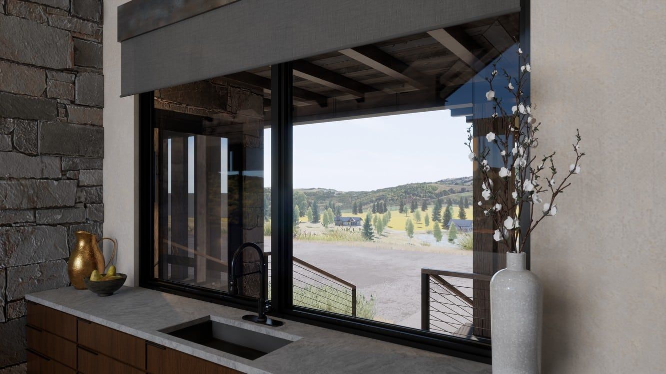 A kitchen with a sink and a large window with a view of the mountains.