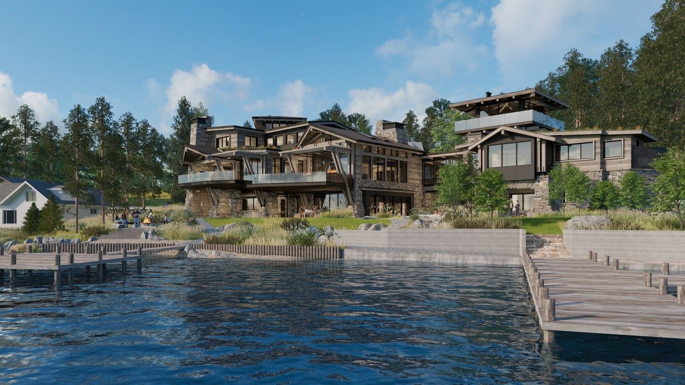 A large house is sitting on the shore of a lake next to a dock.