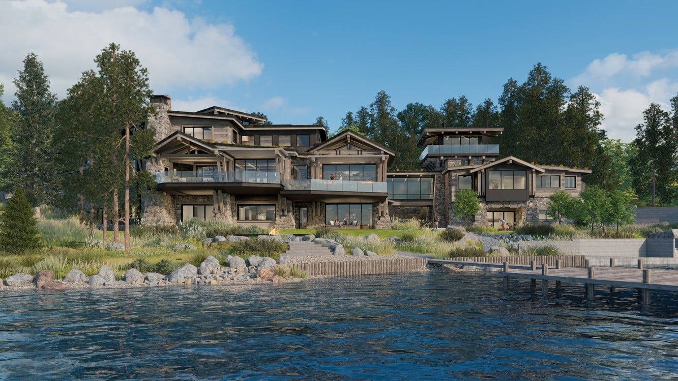 A large house is sitting on the shore of a lake surrounded by trees.