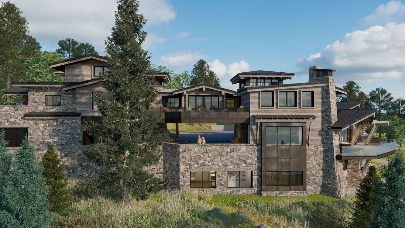 A large stone house is surrounded by trees and grass.