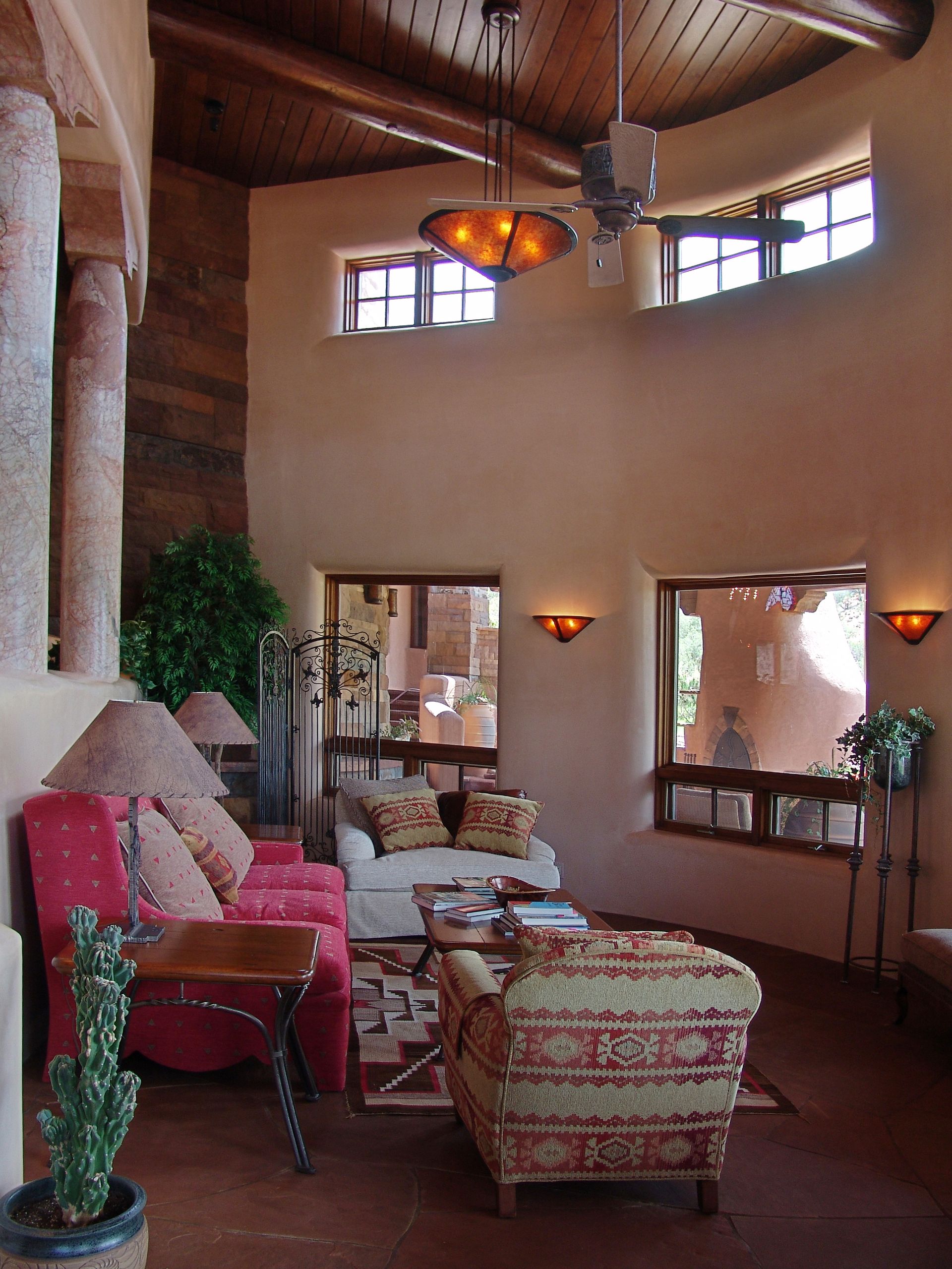 A living room filled with furniture and a ceiling fan