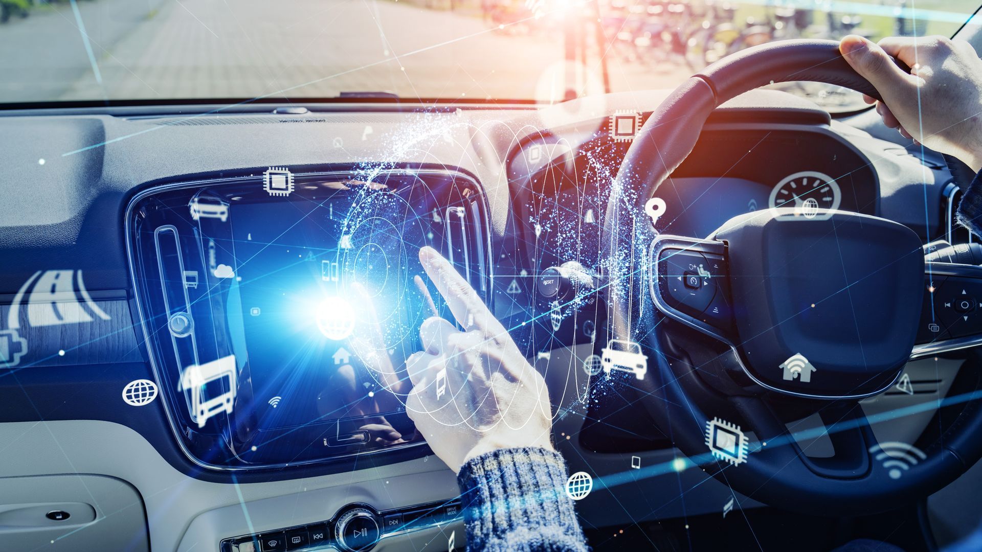 Driver Using a Touchscreen Dashboard in A Car — Eurobodalla Windscreens in Tuross Head, NSW