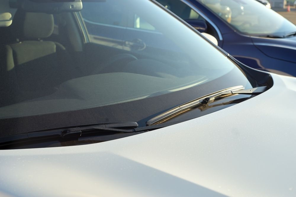A White Car Is Parked Next To A Blue Car — Eurobodalla Windscreens in Moruya, NSW