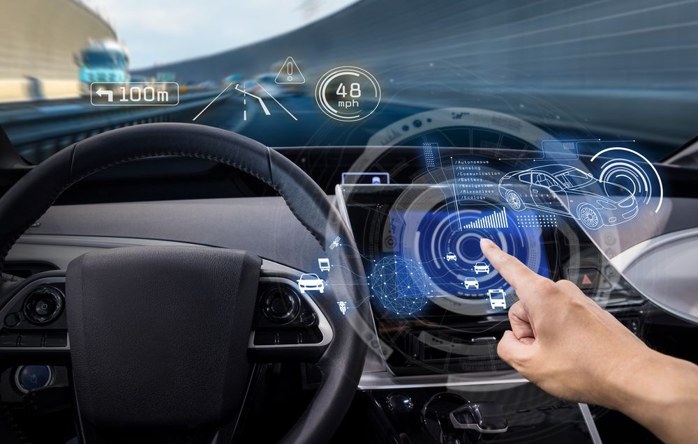 Driver Using Touchscreen Dashboard with Holographic Style Blue Interface Elements — Eurobodalla Windscreens in Dalmeny, NSW
