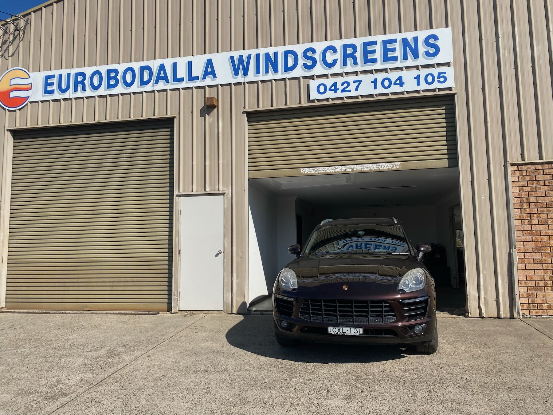 A Person Is Repairing A Windshield On A Car — Eurobodalla Windscreens in Moruya, NSW