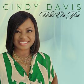 A woman is smiling on the cover of a cindy davis album