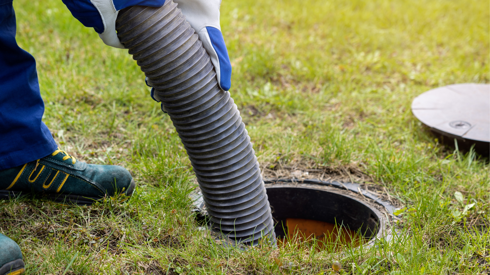 a person is pumping a hose into a septic tank