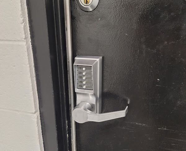 Locks Keys and More | A close up of a door with a digital lock on it.