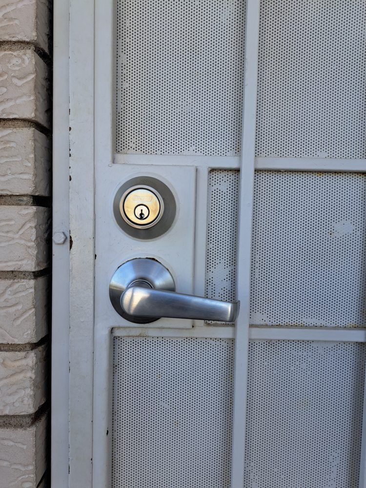 Locks Keys and More | A close up of a door with a handle and lock
