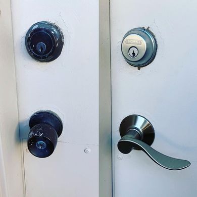 Locks Keys and More | A white door with a black door knob and a silver door handle.