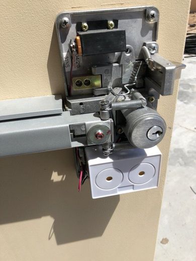 Locks Keys and More | A close up of a door lock on a wall.