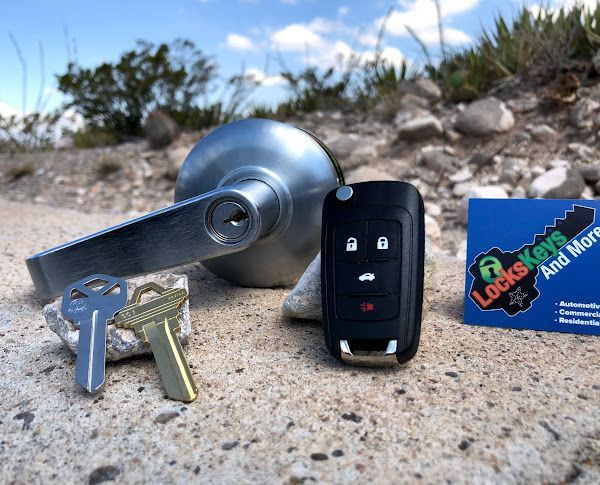 Locks Keys and More | A bunch of keys are laying on the ground next to a car key.
