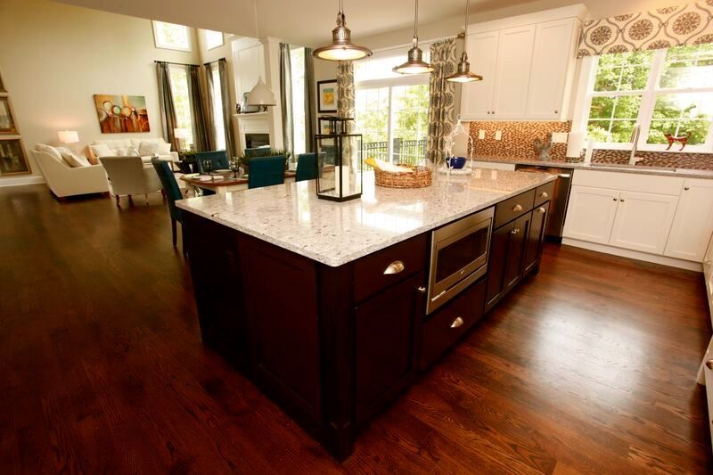 There is a large island in the middle of the kitchen.